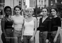 Group of diverse young women posing outdoors confidently