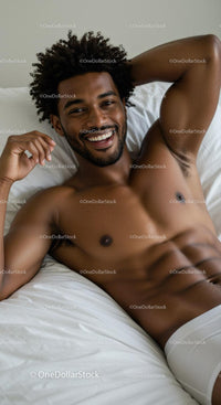 Smiling young man relaxing on bed in white underwear