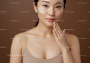 Young Woman Applying Facial Moisturizer for Radiant Skin