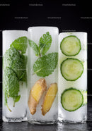 Fresh herbs ginger and cucumber ice cubes in dark