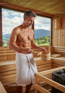 Mature Man Relaxing in Wooden Sauna with Mountain View
