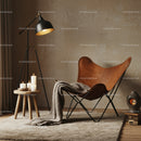 Cozy corner with leather chair and soft blanket