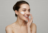 Young Woman Applying Face Cream in Skincare Routine
