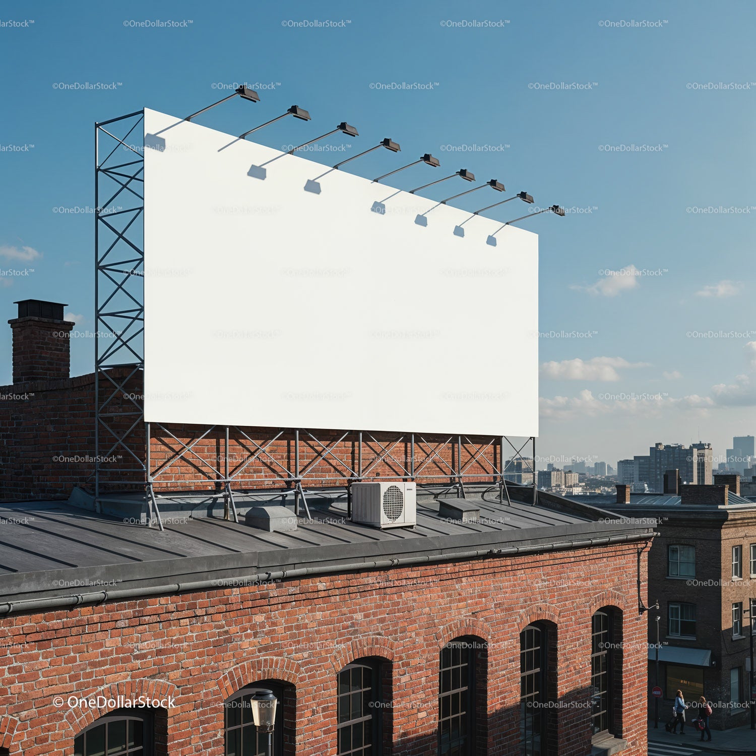 Large blank billboard on urban rooftop at clear sky