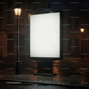 Illuminated billboard on rainy empty city street at night