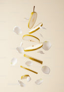 Floating Sliced Pear with Delicate White Flower Petals