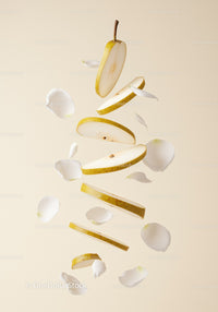 Floating Sliced Pear with Delicate White Flower Petals