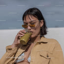 Fashionable Woman Drinking Matcha Latte Outdoor Lifestyle Scene