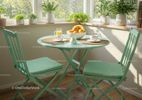 Cozy Breakfast Nook with Green Chairs and Fresh Fruit