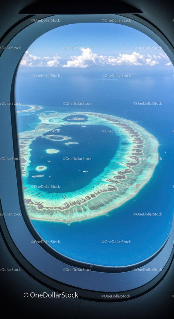 Spectacular aerial view of a tropical island with turquoise lagoon and coral reefs