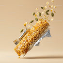 Crunchy granola bar with honey splash and seeds