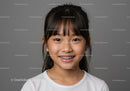 Young Girl with Braces Smiling Portrait with Gray Background