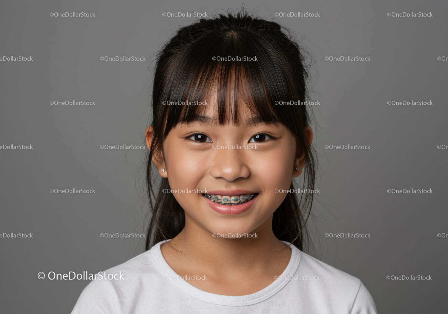 Young Girl with Braces Smiling Portrait with Gray Background