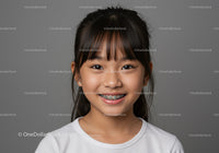 Young Girl with Braces Smiling Portrait with Gray Background