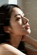 Serene Asian woman enjoying soft natural light