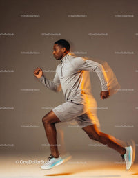 Athlete sprinting indoors with dynamic motion blur