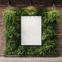 Vertical garden with blank frame on brick wall
