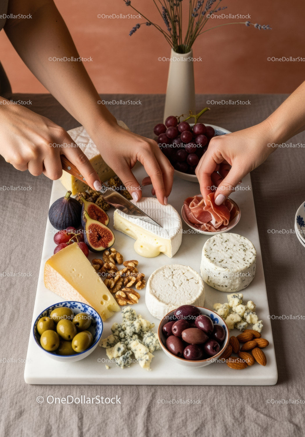 Gourmet Cheese Platter with Figs Grapes Nuts Olives and Prosciutto