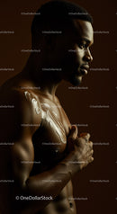 African Man with Muscular Build and Contemplative Expression in Artistic Studio Portrait