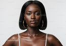 Elegant Portrait of a Black Woman with Gold Hoop Earrings and Smooth Skin