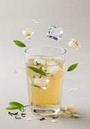 Refreshing Iced Herbal Tea with Jasmine Flowers and Green Leaves