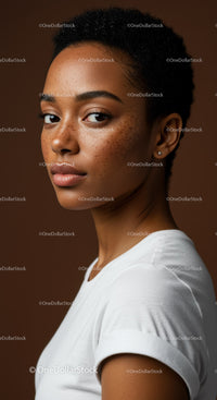Close-up Portrait of Young Woman with Freckles and Short Curly Hair