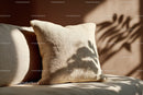 Elegant Beige Cushion with Textured Fabric and Sun Shadows