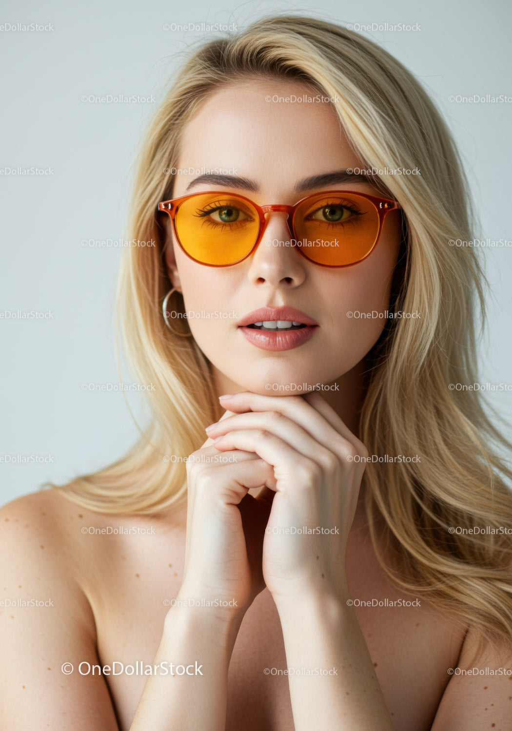 Stylish Blonde Woman Wearing Orange Sunglasses in Fashion Portrait