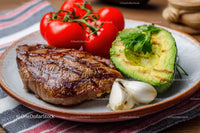 Fresh Tomato and Avocado Slices with Grilled Steak on Rustic Plate