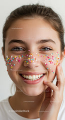 Joyful Young Woman with Colorful Sprinkles on Her Face for Celebration