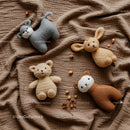 Handmade Soft Animal Plush Toys on Cozy Brown Fabric
