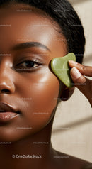 Close-up of Woman Using Green Jade Facial Tool for Skin Care