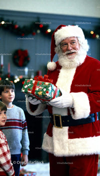 Santa Claus giving a Christmas gift to excited children