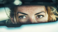 Close-up of Woman with Brown Eyes and Freckles Looking Outdoors