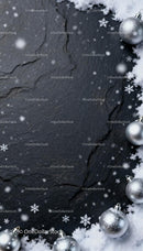 Silver Christmas Ornaments with Snow on Dark Slate Surface
