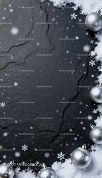 Silver Christmas Ornaments with Snow on Dark Slate Surface