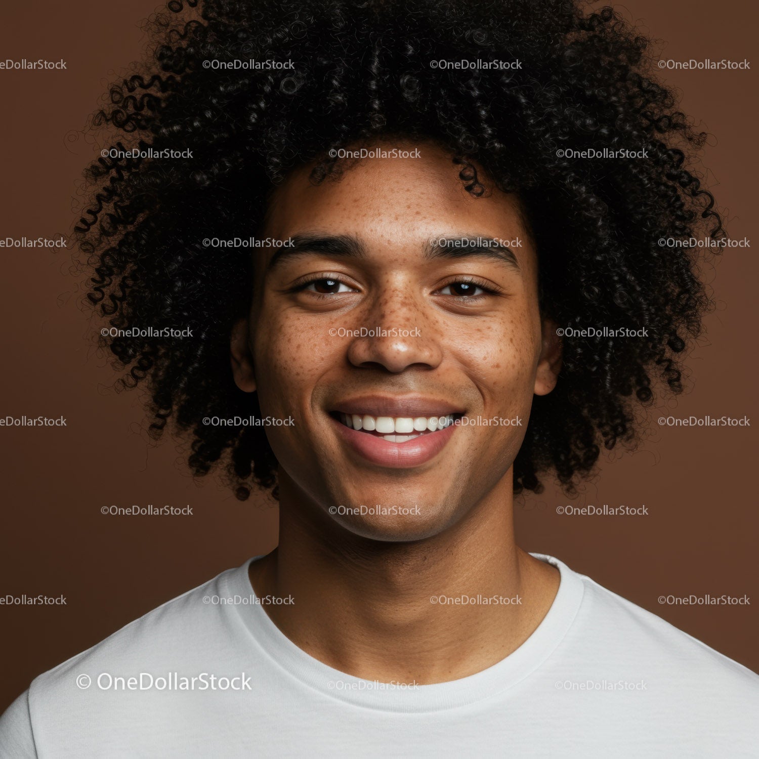 Portrait of a Smiling Man with Curly Hair and Freckles