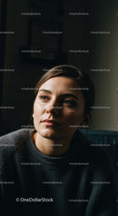 Portrait of a Young Woman in Casual Clothing with Thoughtful Expression