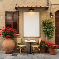 Cozy outdoor cafe table with vibrant red flowers