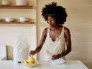 Woman Preparing Fresh Bananas in Modern Kitchen for Healthy Snack