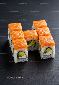 Fresh salmon sushi rolls with avocado and cream cheese