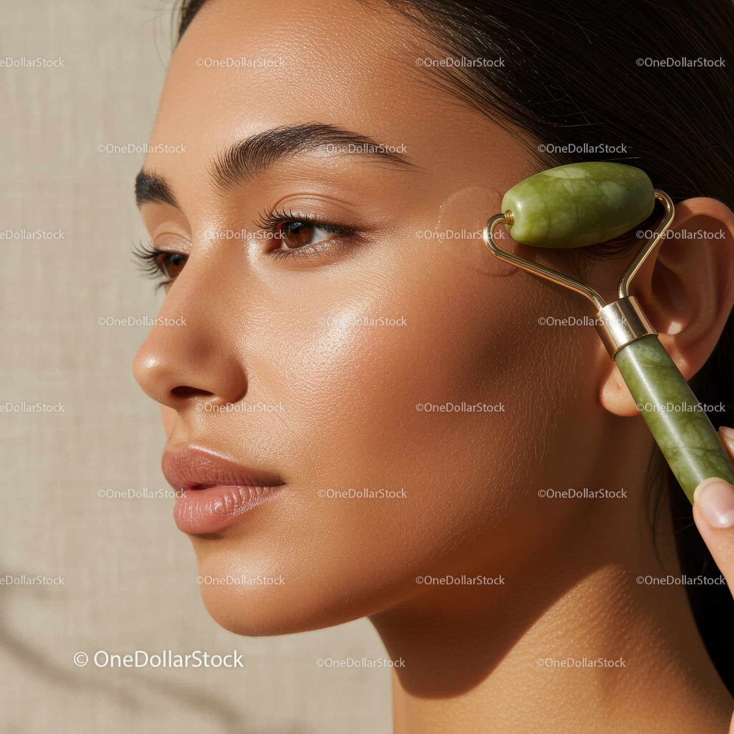 Woman Using Jade Roller for Glowing Skin and Facial Rejuvenation