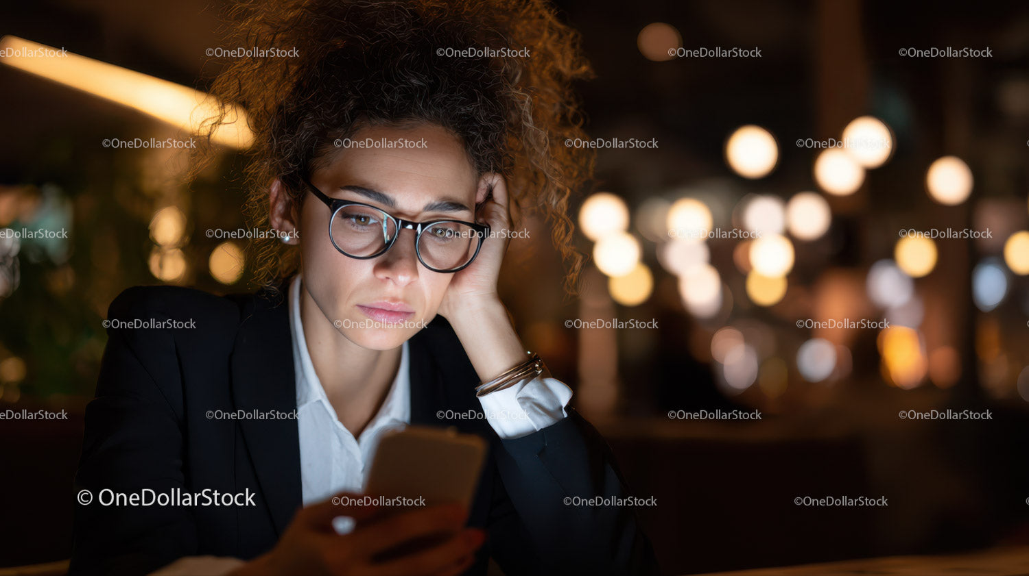 Young Woman in Business Attire Looking at Smartphone in Night City