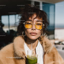 Fashionable Young Woman in Yellow Sunglasses Posing Outdoors on Sunny Day