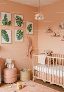 Cozy Baby Nursery with Plush Teddy Bear and Tropical Wall Art