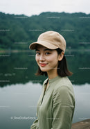 Smiling Woman in Casual Outfit Near Lake with Greenery Background