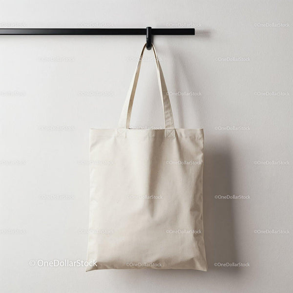 Plain canvas tote bag hanging on modern rack JPG Mockup Image