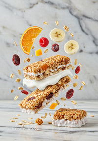 Healthy granola bars with fresh fruits and yogurt cream