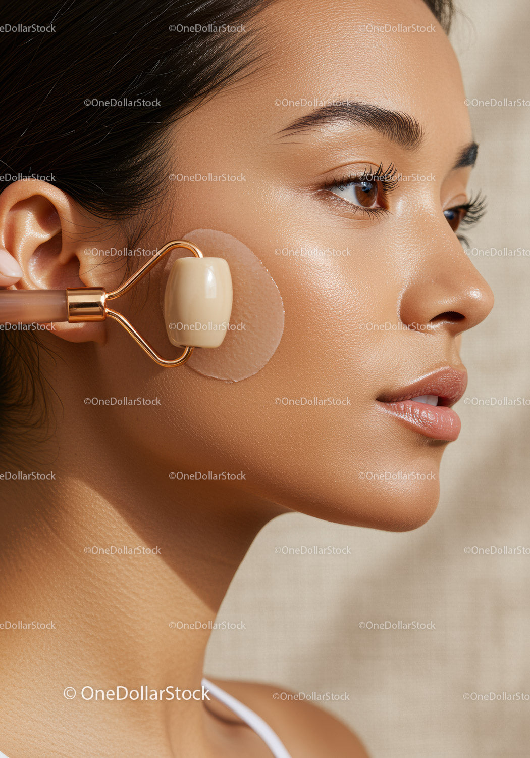 Close-up of Woman Using Jade Roller for Facial Skincare