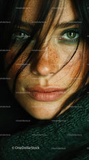 Close-Up of Young Woman with Green Eyes and Freckles